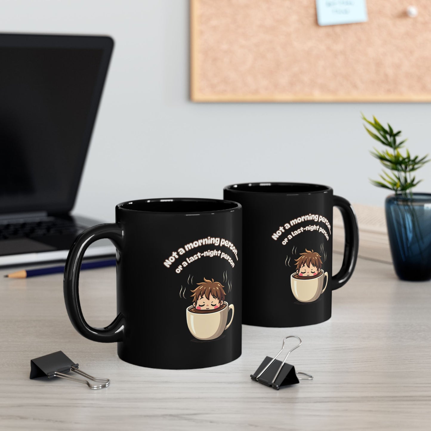 Black coffee mug with cartoon character sleeping in cup, 'Not a morning person or a last-night person' print