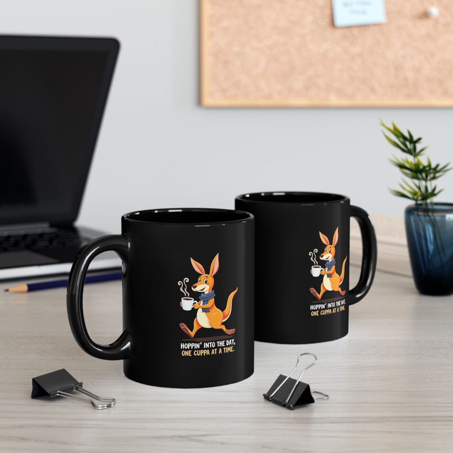 Black coffee mug with cartoon kangaroo holding a cuppa, text reads Hoppin' Into The Day One Cuppa At A Time