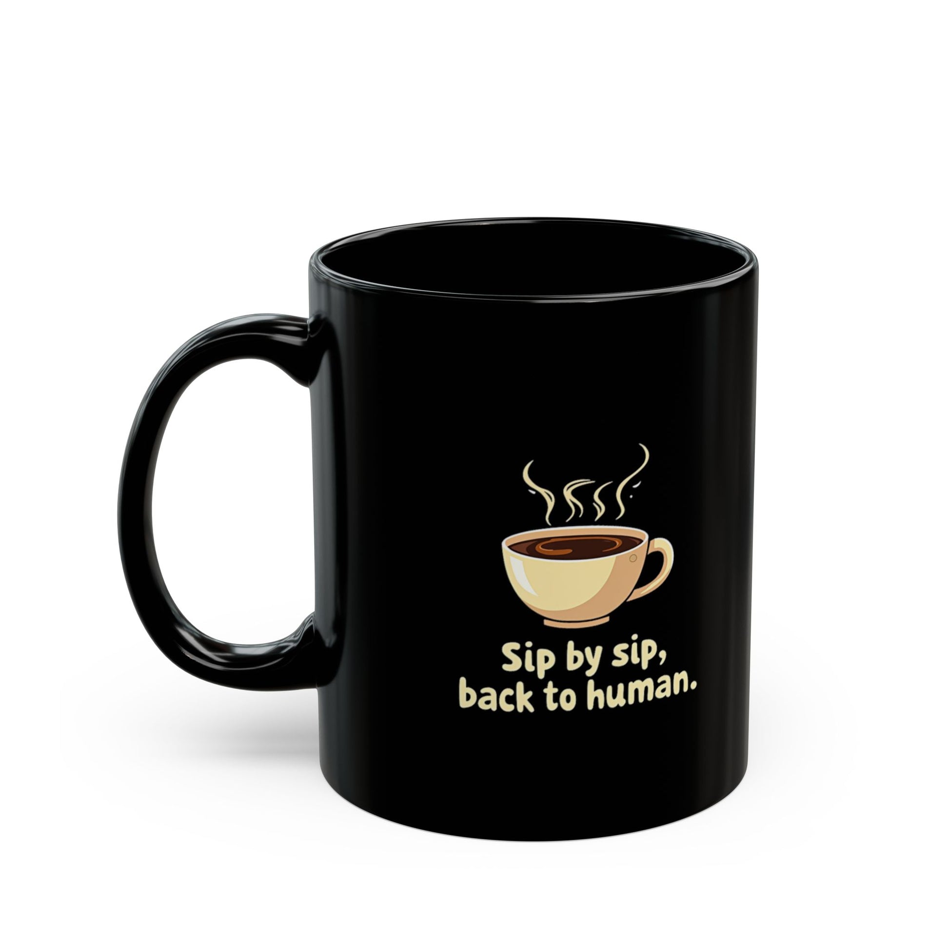 Black ceramic coffee mug with steaming cup graphic and 'Sip by sip, back to human.' text. Funny gift for coffee lovers.