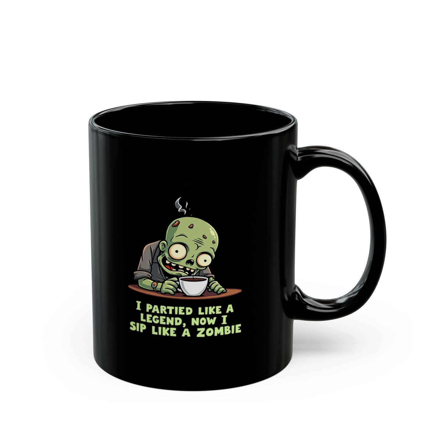 Black coffee mug with cartoon zombie sipping coffee and text 'I Partied Like a Legend, Now I Sip Like a Zombie'