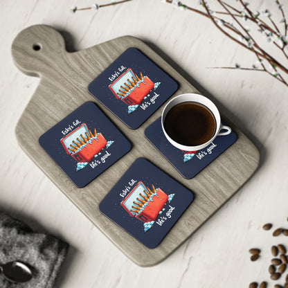 Set of 4 navy Esky's Full Coasters with red esky and beer bottles print, displayed on wooden board with coffee cup