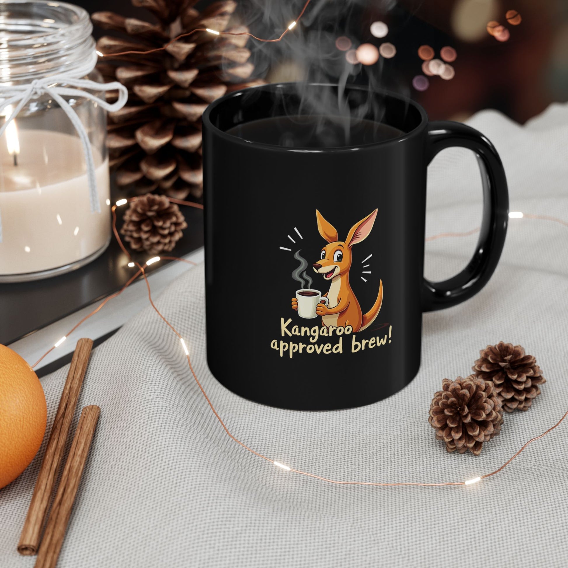 Black coffee mug with cartoon kangaroo holding a cuppa, text reads Kangaroo approved brew, steam rising