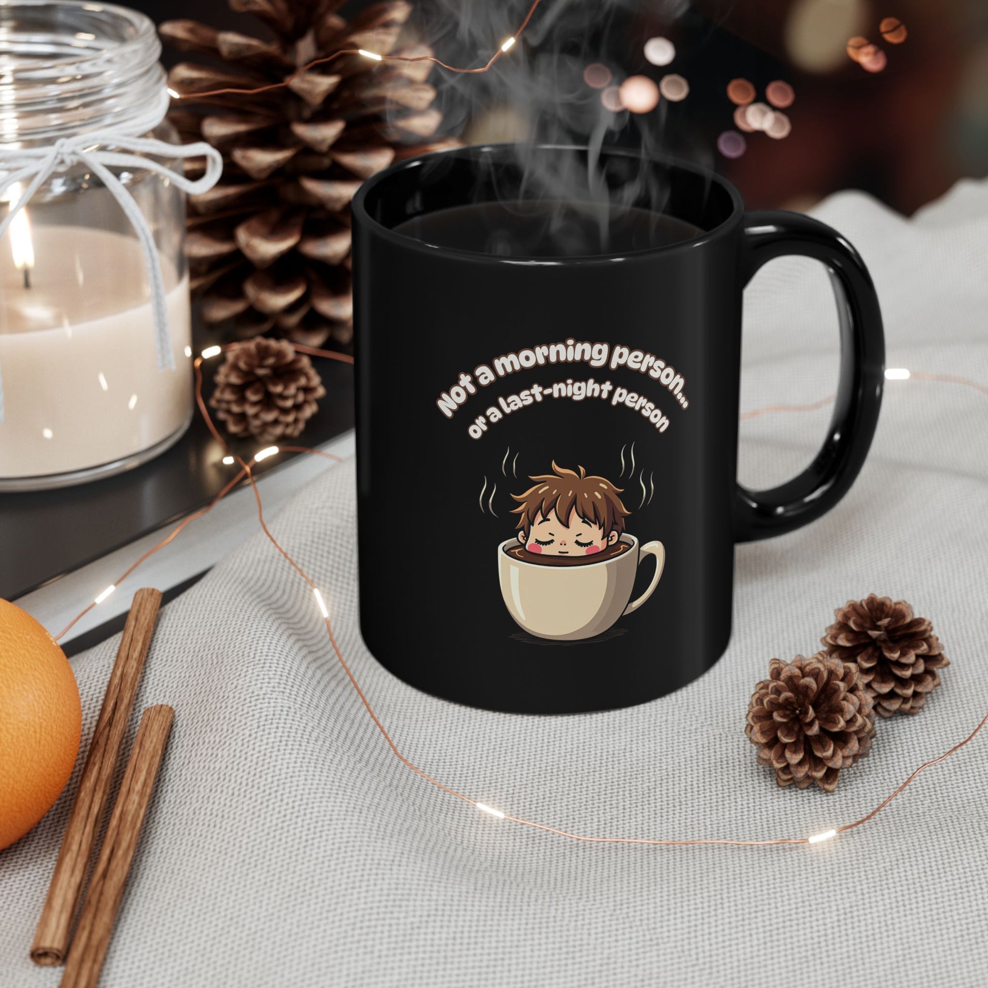 Black coffee mug with 'Not a Morning Person' quote and sleepy anime character in a cup, steaming hot drink
