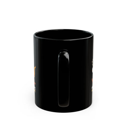 Hopping black ceramic coffee mug with orange graphic design, handle facing back, shown on white background