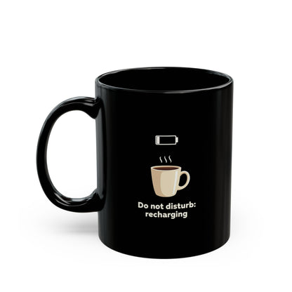 Black ceramic coffee mug with low battery icon, steaming coffee graphic and "Do not disturb: recharging" text
