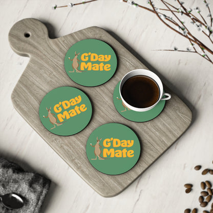 G'Day Mate Coasters set of four, green round coasters with kangaroo design, shown with coffee cup on timber board