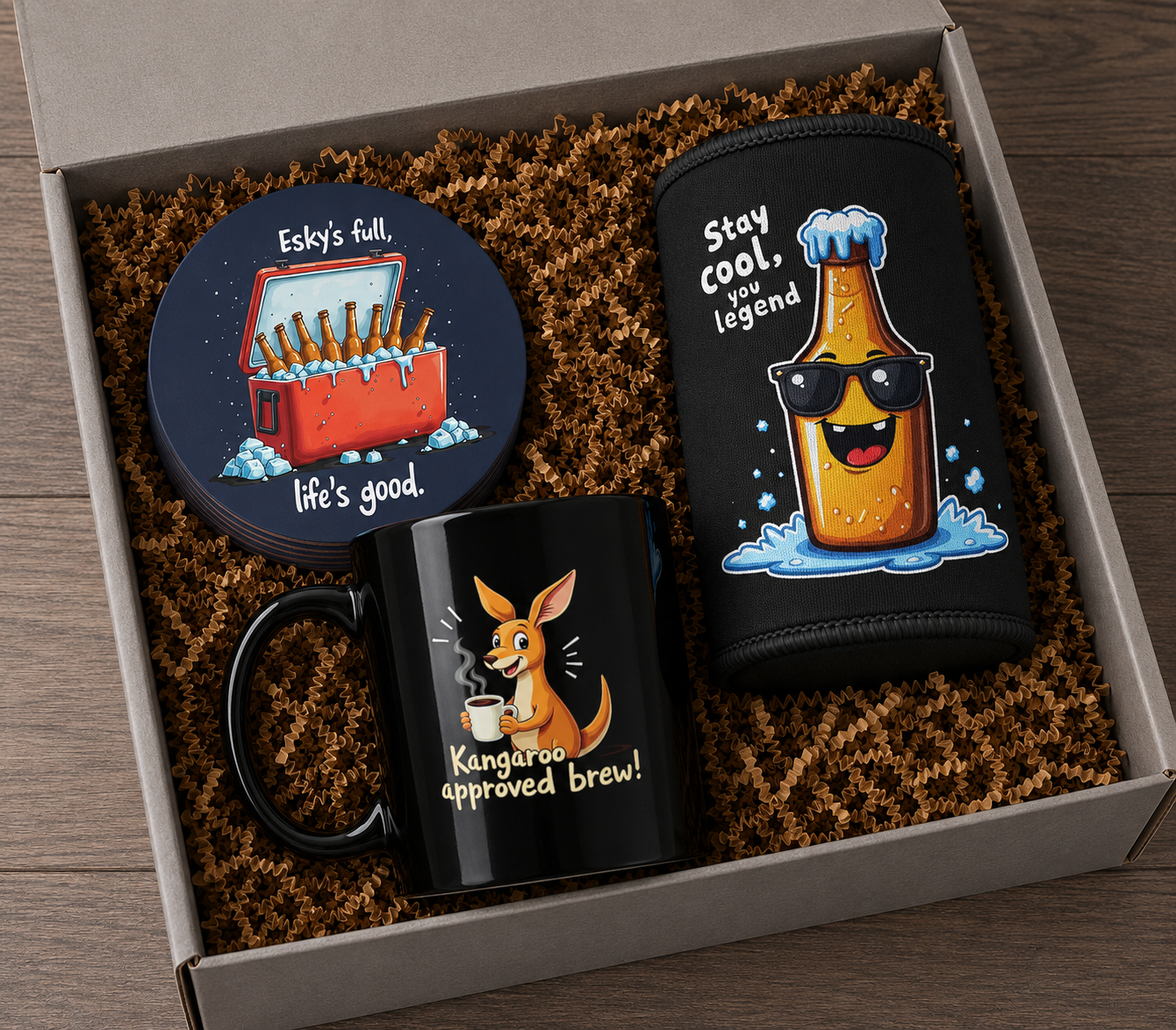 Pub Crawl gift bundle in box: black kangaroo mug, stubby cooler, and esky coaster set on brown crinkle fill